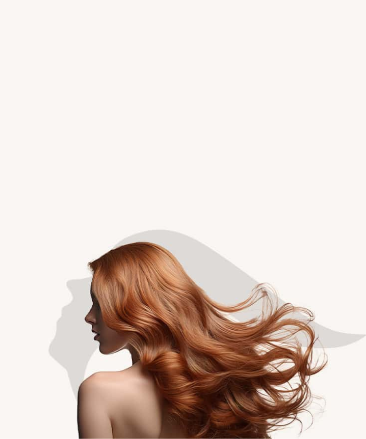 A woman with long red hair standing in front of a white wall
